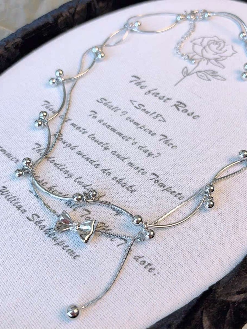 Silver Bow Accent Women's Necklace - Elegant Beaded Design